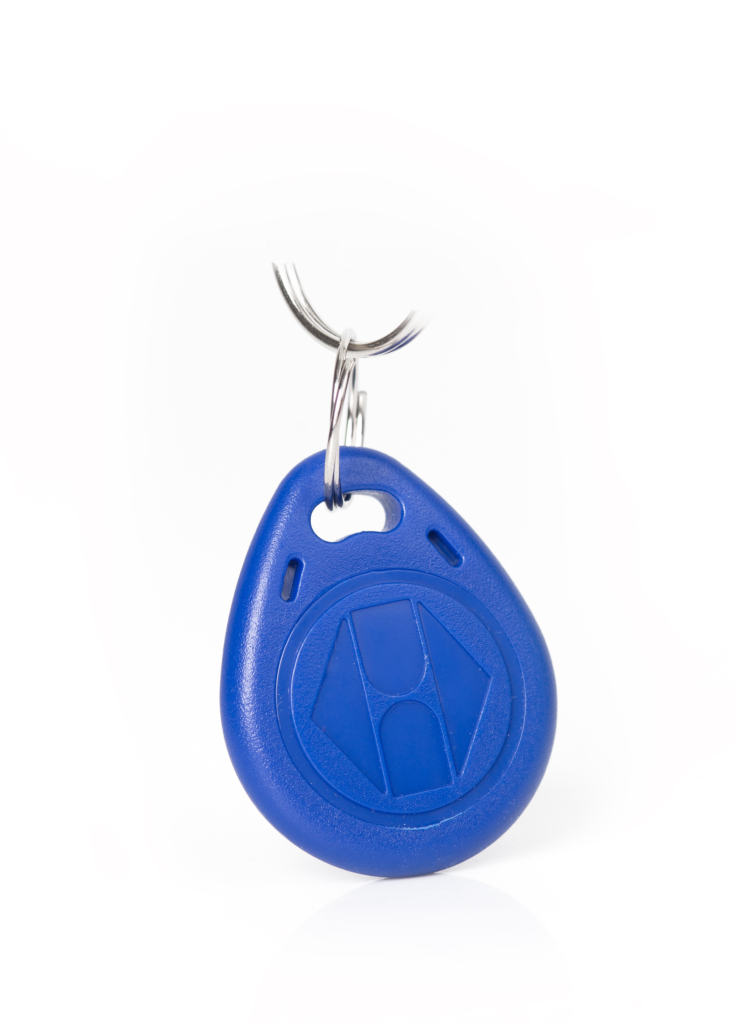 Blue electronic "finder" keyfob as an example of a tool for distracted drivers.